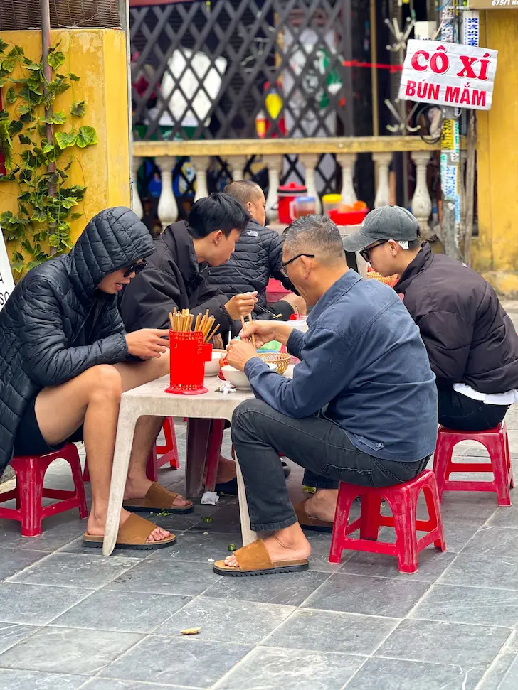 best things to eat in Hanoi - bowl of pho bo on a street-side table