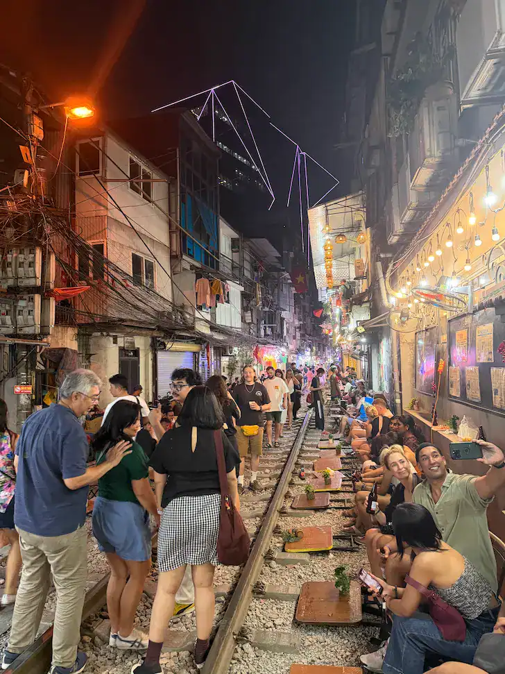 A very busy Train Street in Hanoi, the perfect place to end the first day of your 2 week vietnam itinerary