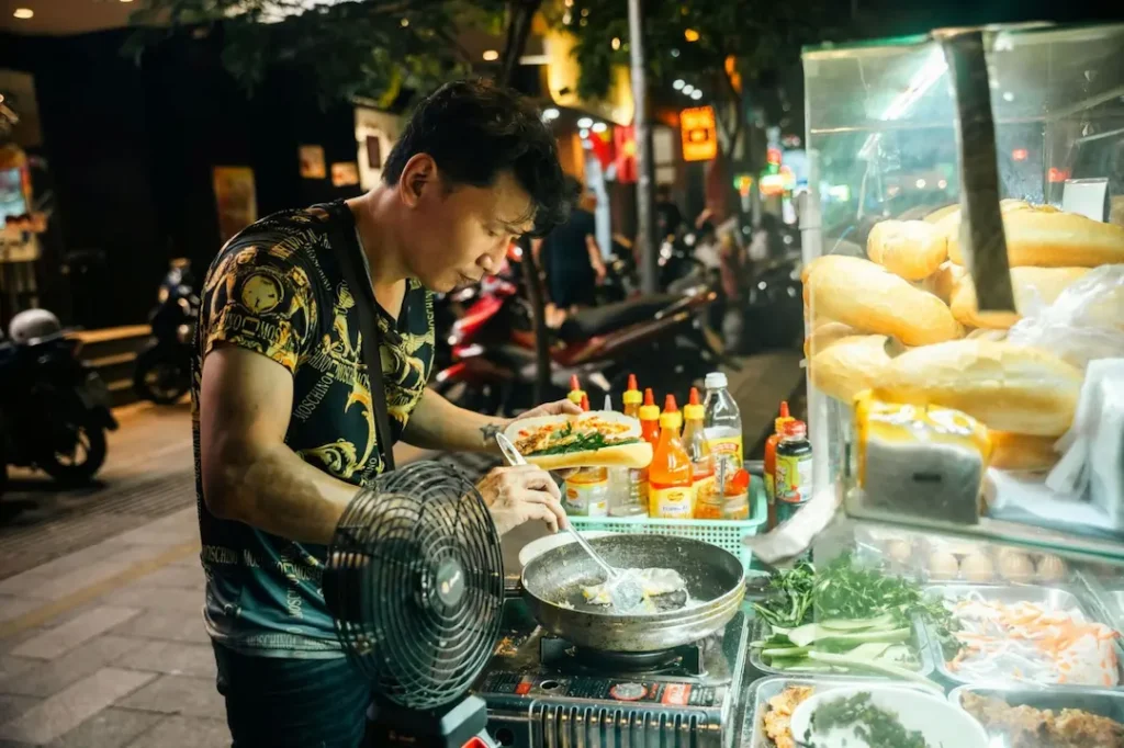Street food vendor in Ho Chi Minh City, a year-round highlight whatever month you visit