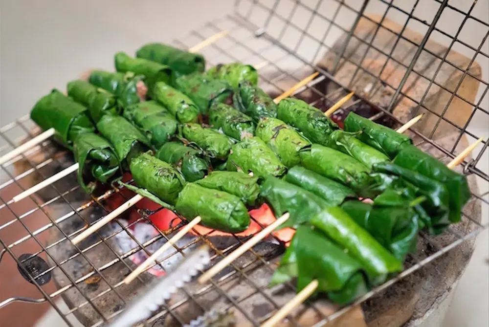 Bo la lot grilled beef in betel leaf, a must eat food in Ho Chi Minh City