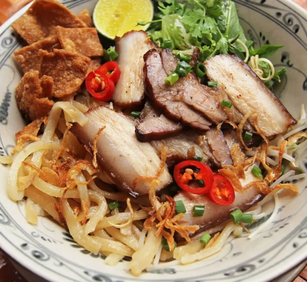 Bowl of cao lau, the signature noodle dish to eat in Hoi An